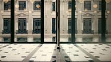 View of a London office building from inside Rothschild & Co's Capital House office in London, UK. Black and white floor tiles in the foreground