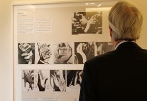 Client from the back viewing painting on hung on the wall