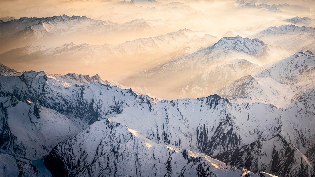 Sun shining on Swiss mountains