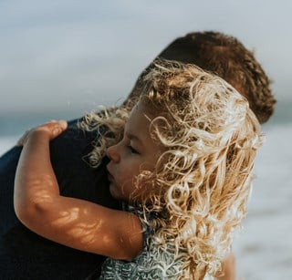 Father and child hugging