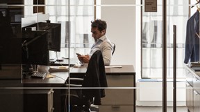 Professional working at their desk in a light bright office environment