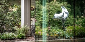 Courtyard of Rothschild & Co's Zurich office, with green plants and a metal sculpture