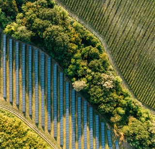 aerial view of fileds with solar panels