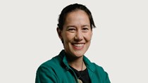 Photo of Natacha Lippens against a stone background