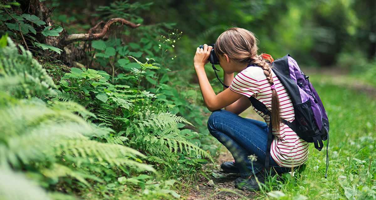 Young girl with binoculars