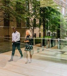 Two colleagues walking through the lobby