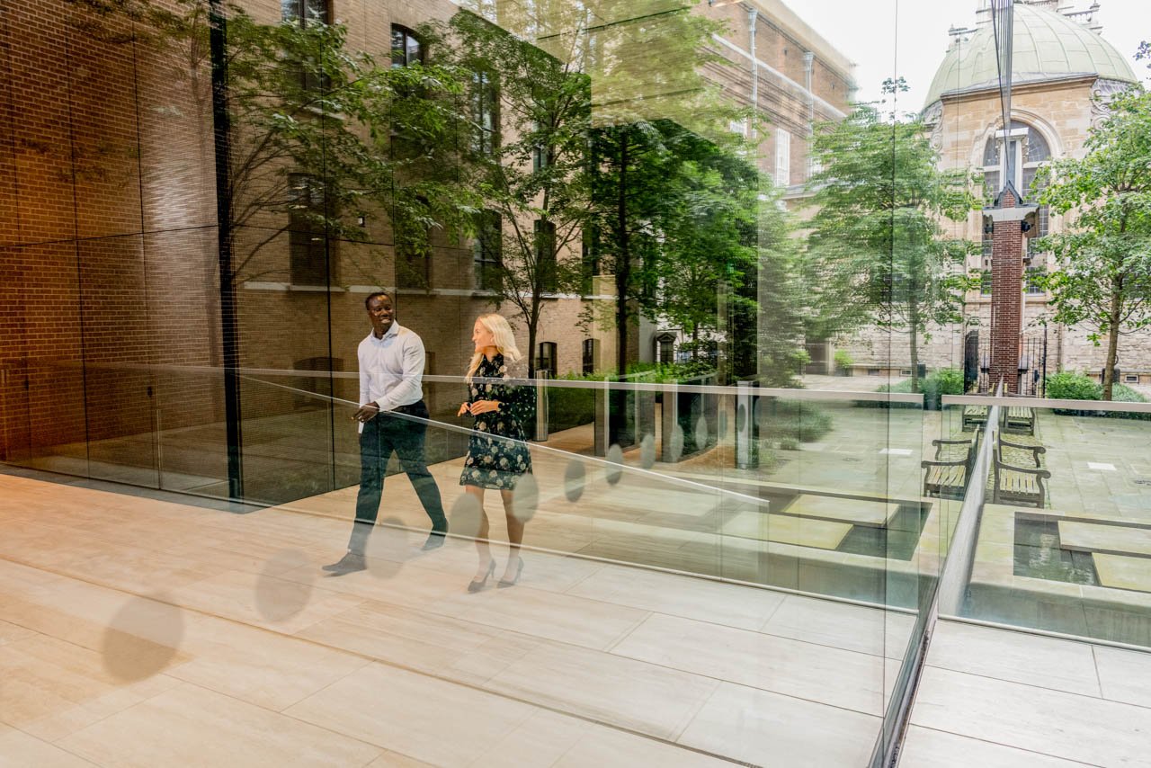 Two colleagues walking through the lobby