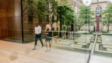 Two colleagues walking through the lobby