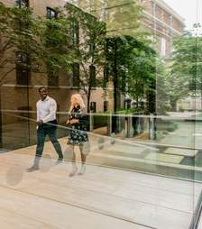 Two colleagues walking through the lobby