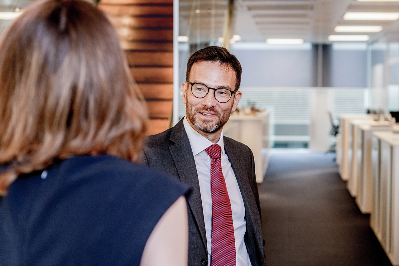 Two people talking in an office