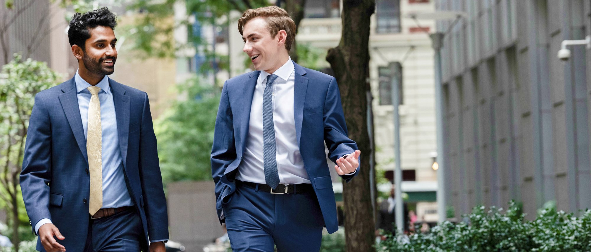 Two young gentlemen taking a stroll through a city green space