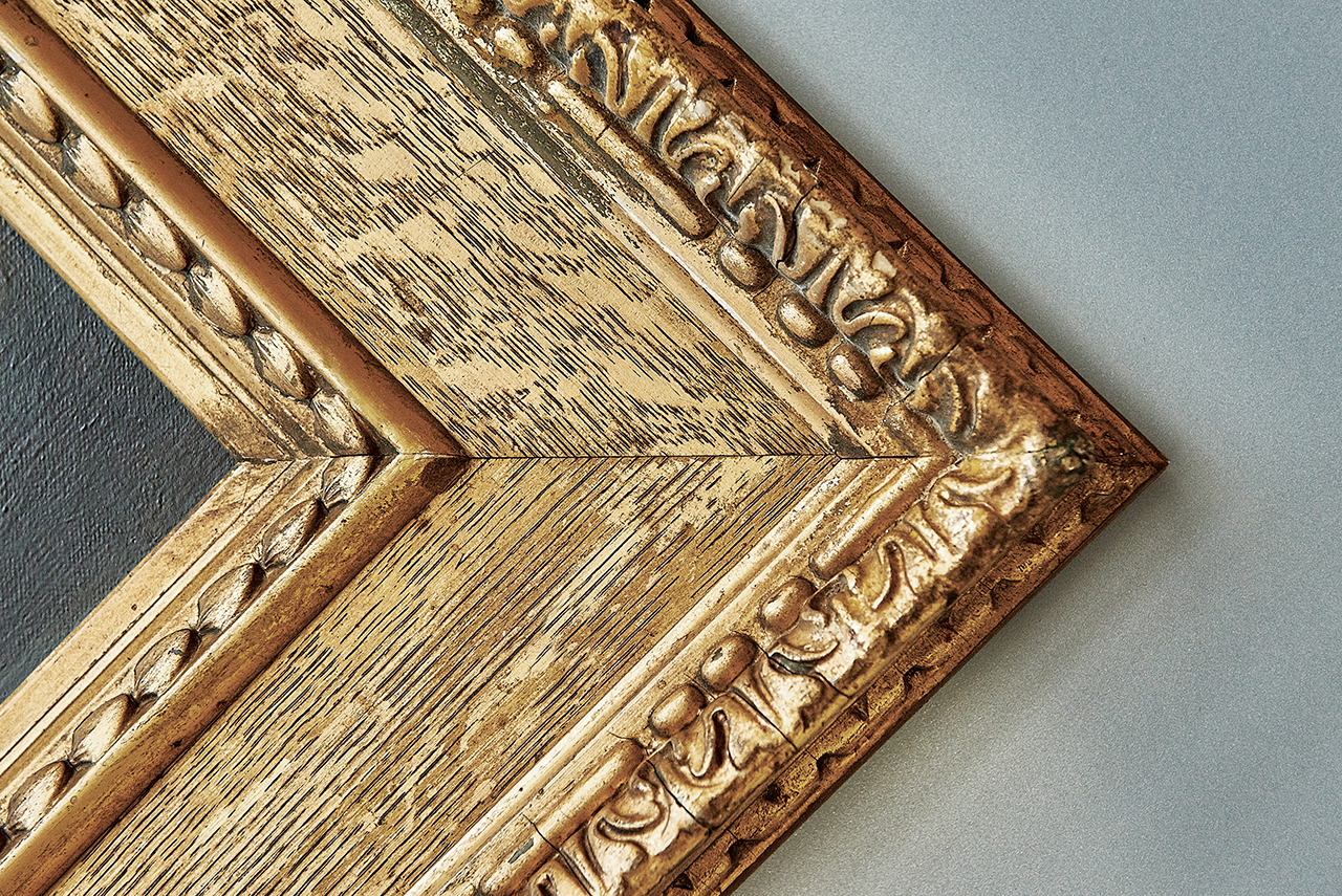 Gold picture frame at an angle