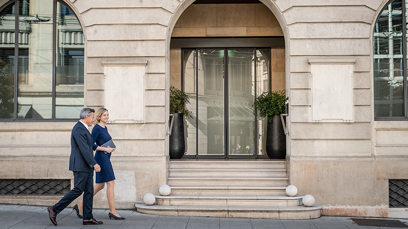 People walking in front of a building