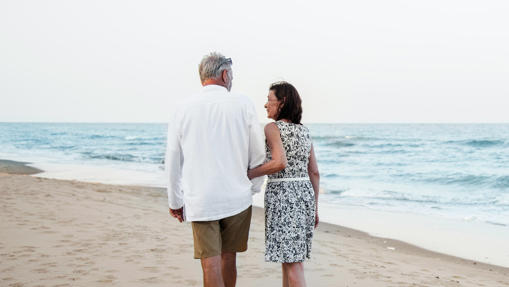 Middle ages ouple walking on the beach 