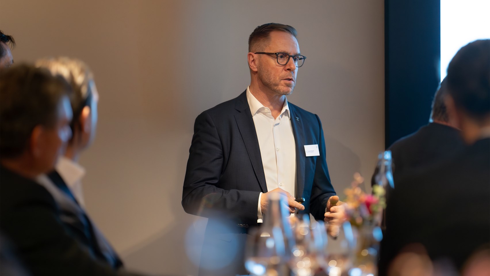 Man presenting in front of an audience