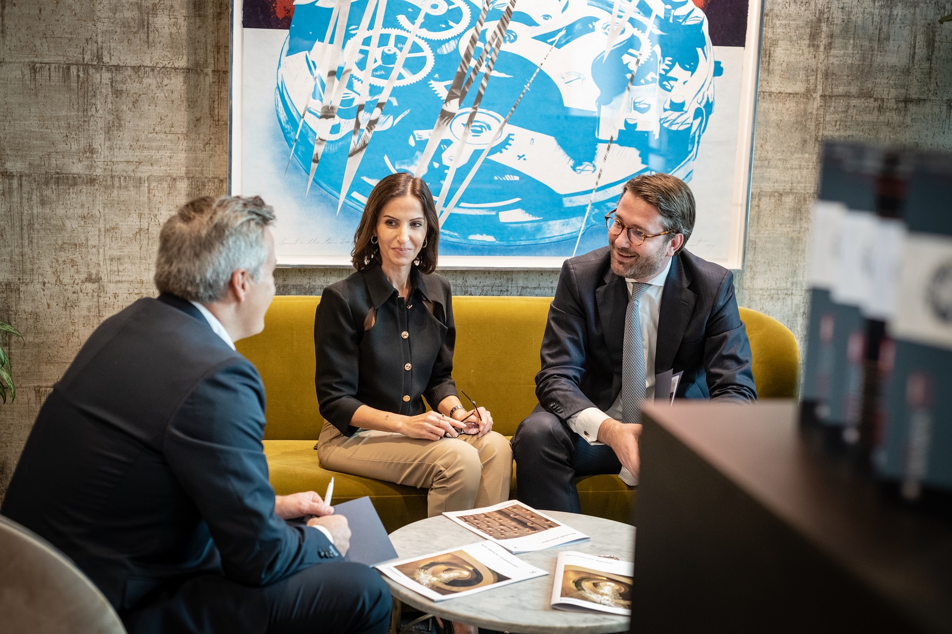 Three people in a business meeting