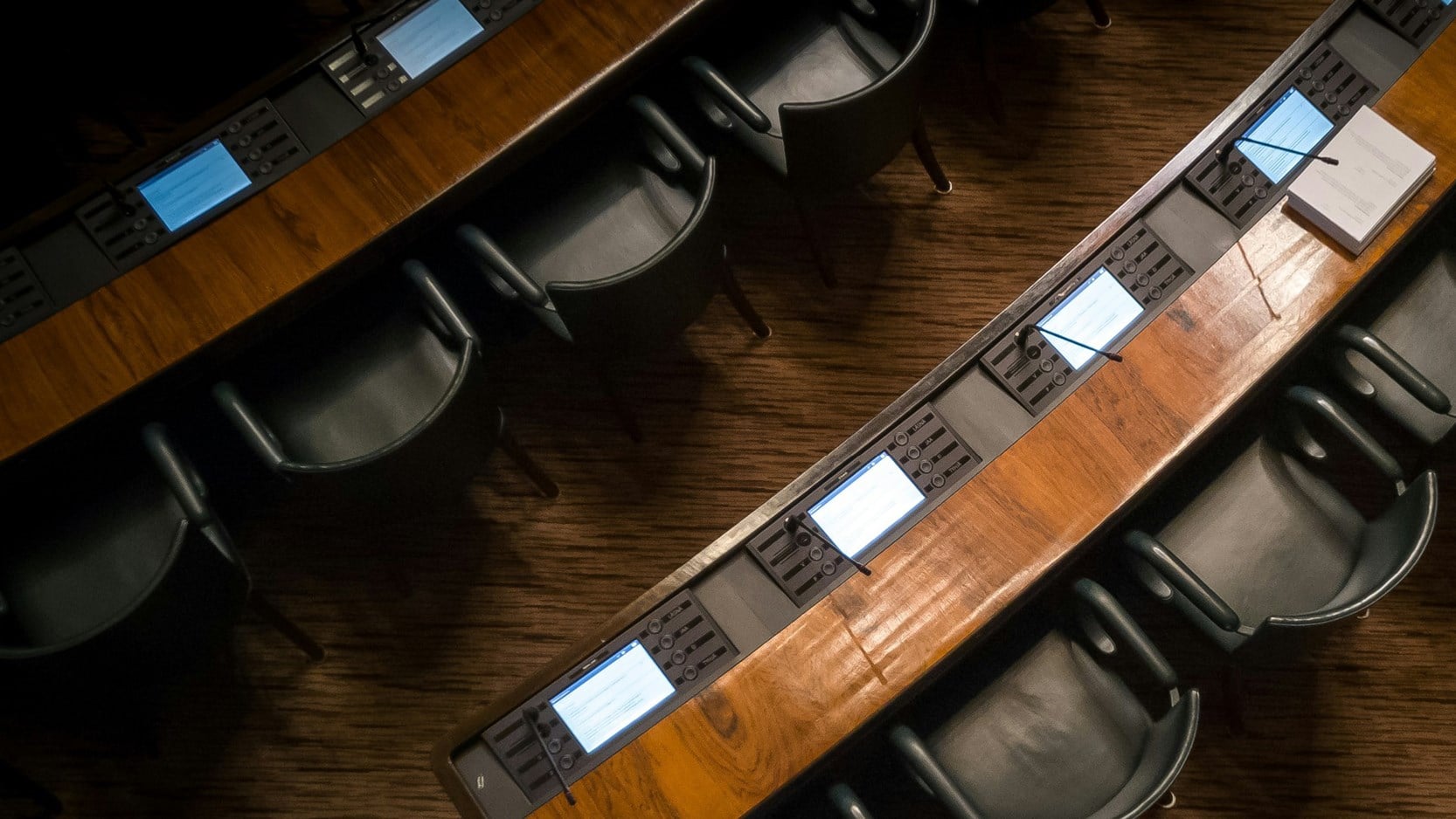 Above-head image of chairs in a boardroom