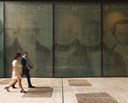 2 individuals walking outside of the Rothschild & Co, New Court offices.