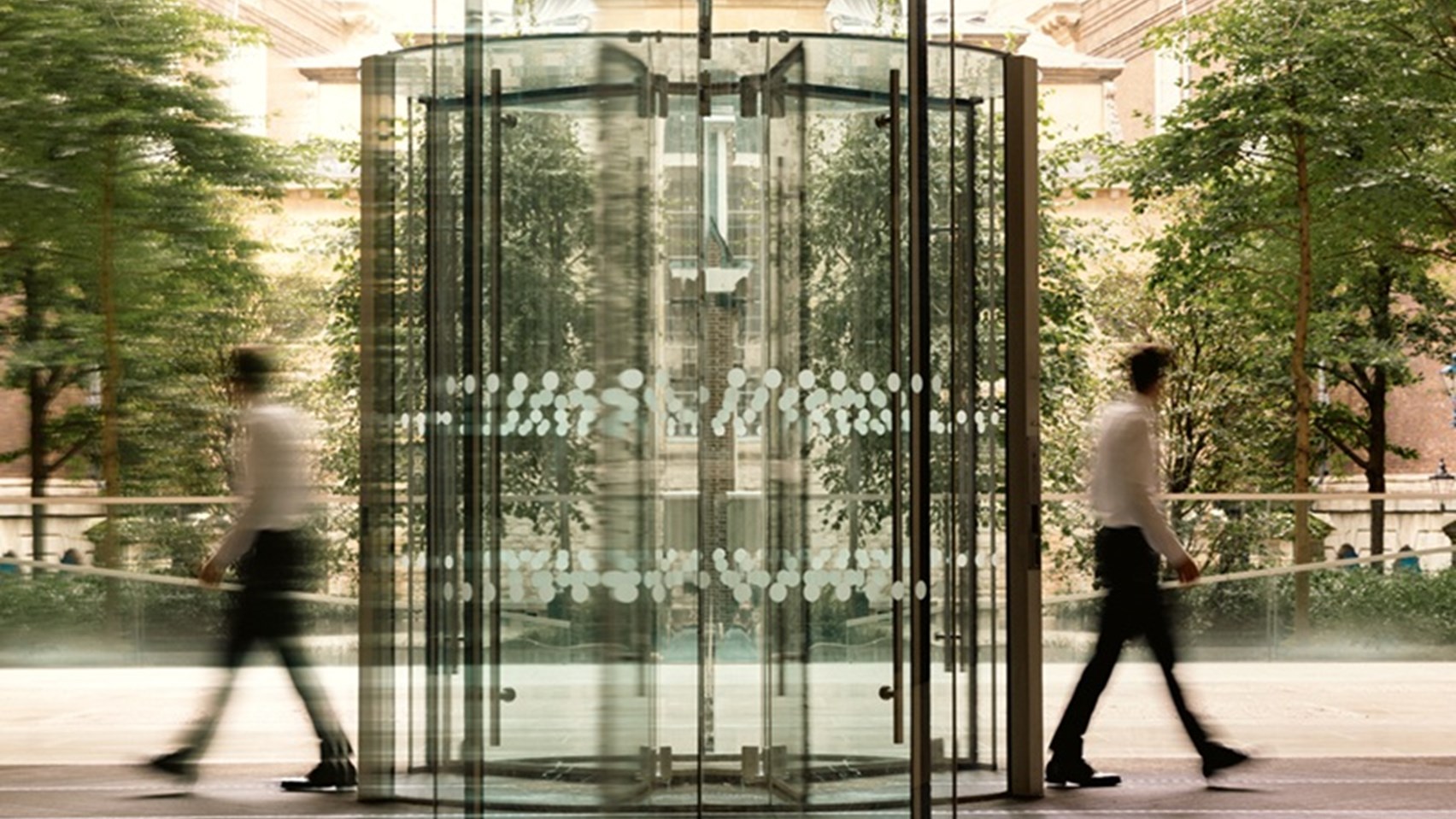 Image of a man walking out of the Rothschild & Co New Court door