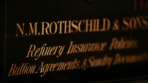 Historic N. M. Rothschild & Sons sign with engraved lettering in low light