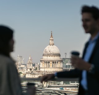 Image of two people on the Rothschild office rooftop, with St Paul's Cathedral in the background