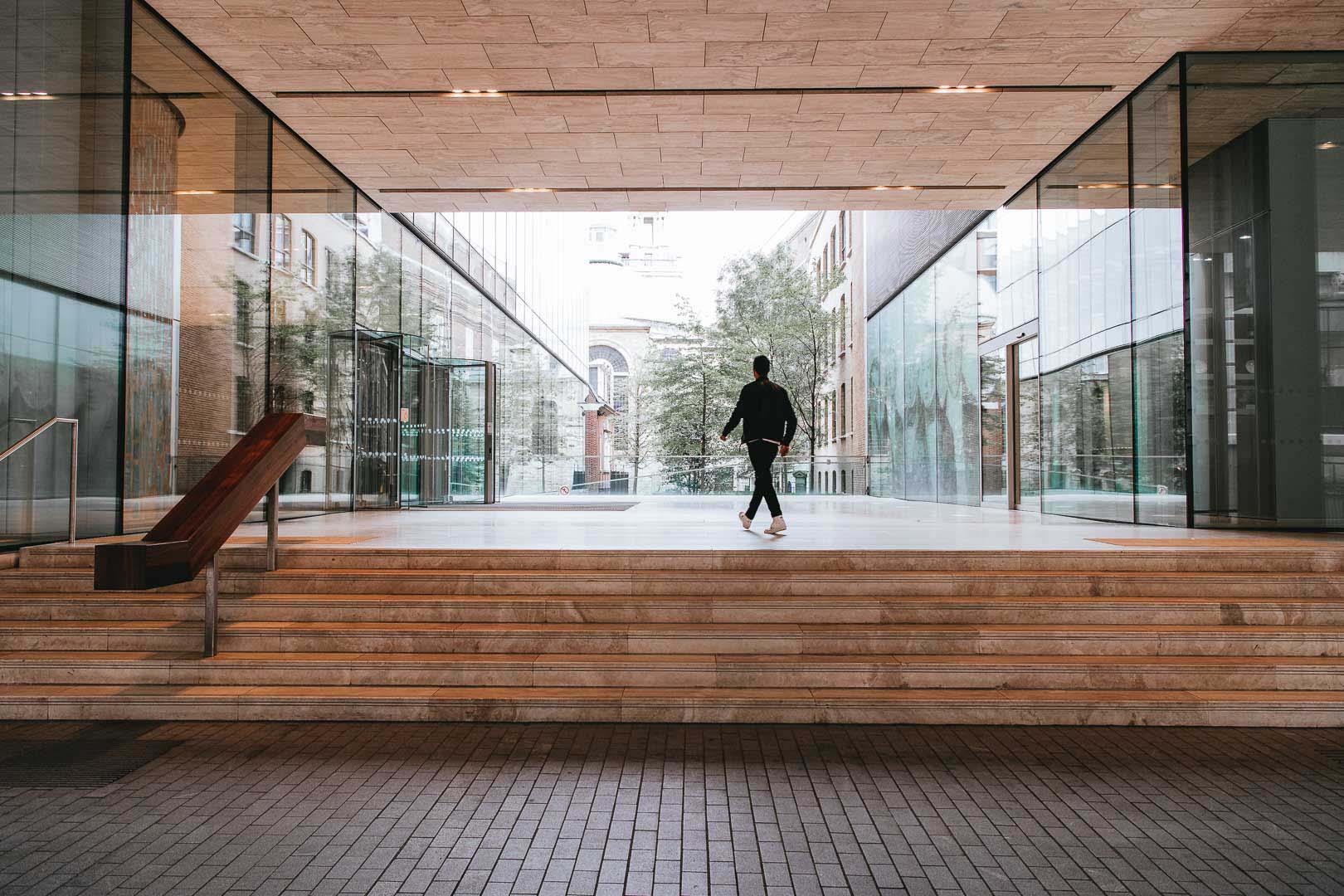 Man in the courtyard of Rothschild & Co New Court offiec