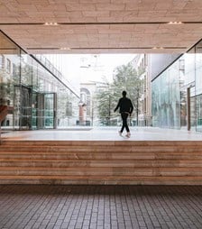 Man in the courtyard of Rothschild & Co New Court offiec