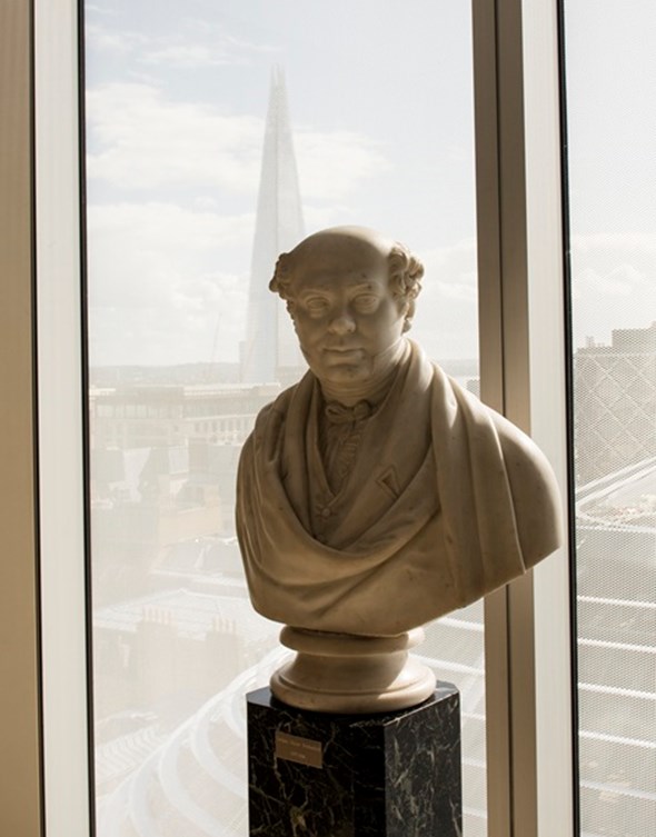 Bust of Nathan Mayer Rothschild by a window overlooking the city of London