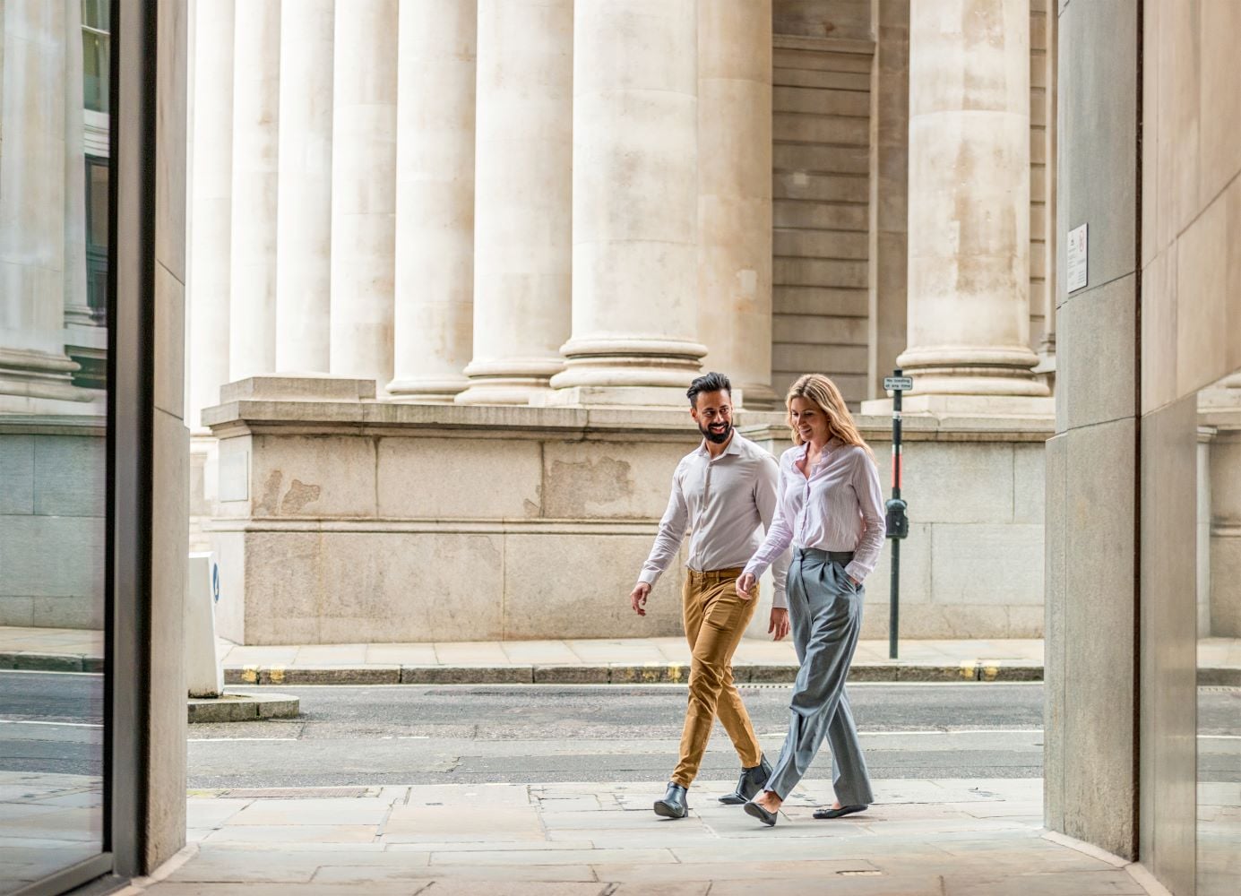 Image of a couple walking through a doorway in London