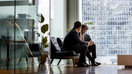 Two people meeting in the Rothschild London office deep in conversation