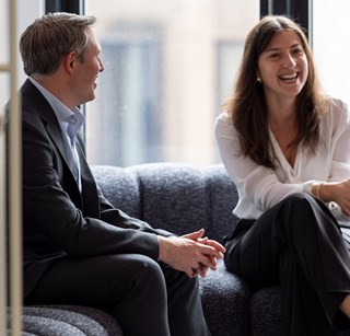 Two people having a conversation at the Rothschild & Co New Court office
