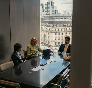 Image of three people having a consultation in an office at Rothschild & Co's New Court office