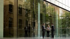 Three people talking outside of the Rothschild & Co New Court office