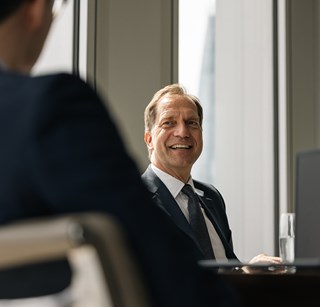 Picture of an individual in a meeting room at Rothschild & Co's London office, New Court