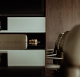 Artistic image of chairs in one of the meeting rooms at Rothschild & Co New Court