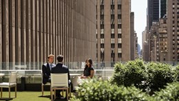 A group of people on the Rothschild USA office having a conversation