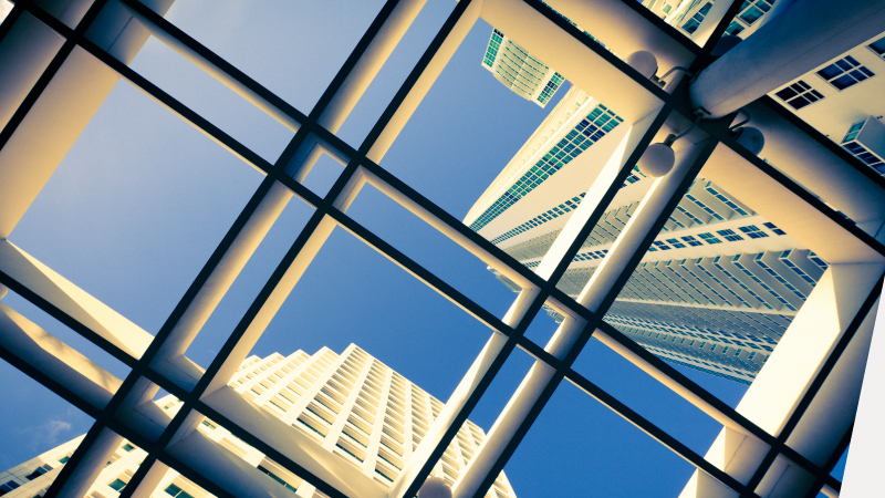Windows above with views of high-rise buildings