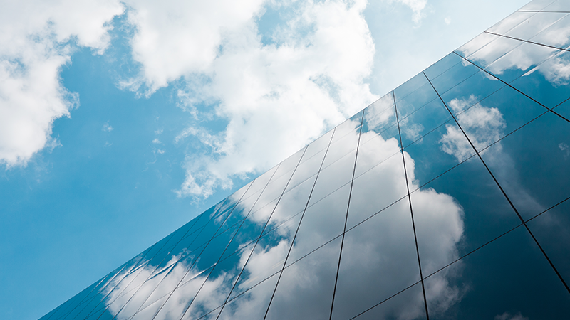 Building windows reflecting clouds