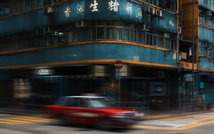 Car driving through streets in Asia
