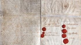 A copy of the original three page partners’ agreement, written in ink on old paper. Each name has a red wax seal to the left hand side of it.